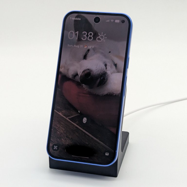 a 3d printed phone charging stand with phone in place