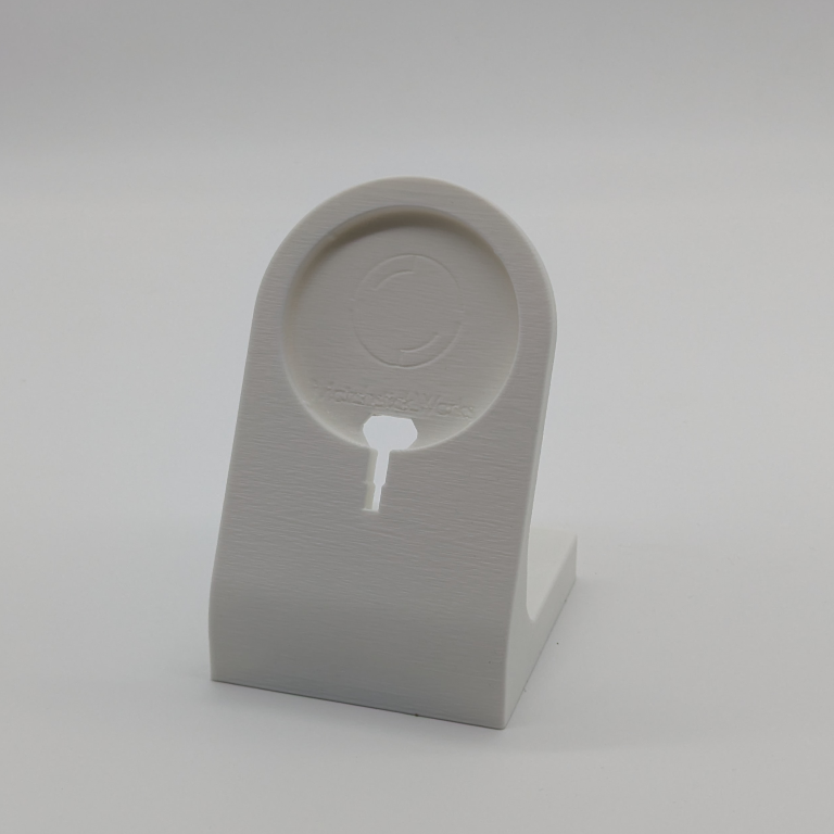 a 3d printed phone charging stand in white